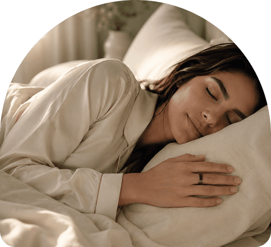Woman sleeping peacefully wearing the Theera wellness ring