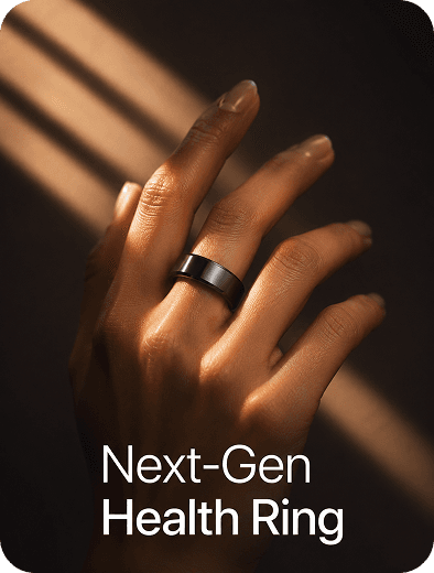 Hand wearing the Theera wellness ring in soft window light