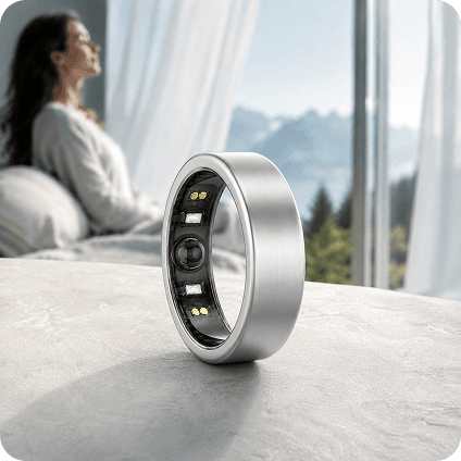 theera Silver smart ring in brushed titanium beside a stream