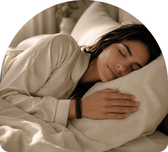 Woman sleeping peacefully wearing the Theera smart band